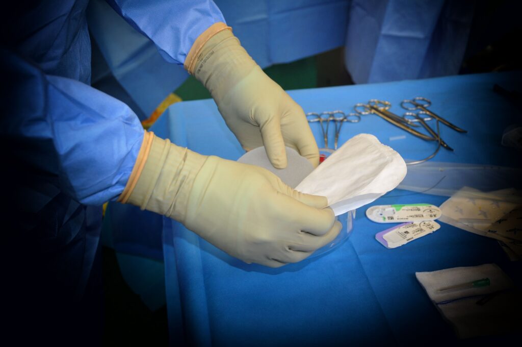 A doctor handling some medical waste.